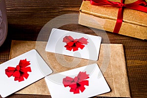 Concept of gift cards on wooden background top view