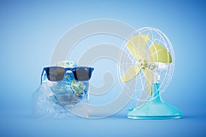 The concept of global warming. A planet in a melting piece of ice and a fan on a blue background. 3D render