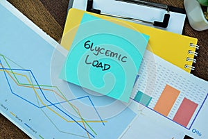 Concept of Glycemic Load write on sticky notes isolated on Wooden Table