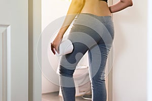 Concept good excretory system,Woman using lavatory with toilet paper after wake up in morning