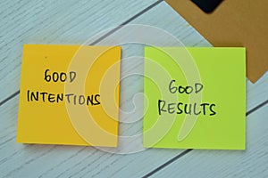 Concept of Good Intentions and Good Results write on sticky notes isolated on Wooden Table