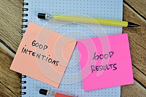 Concept of Good Intentions and Good Results write on sticky notes isolated on Wooden Table