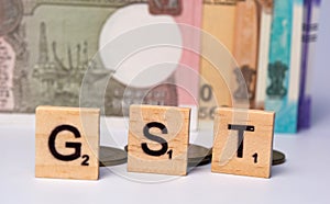 Concept of GST with indian currency on isolated background