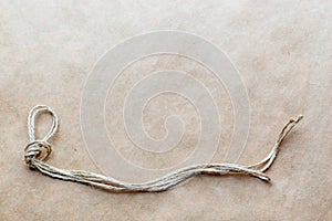 Concept hangman's knot on kraft paper background