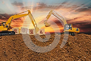 Concept Happy new year 2024,crawler excavator in construction site .