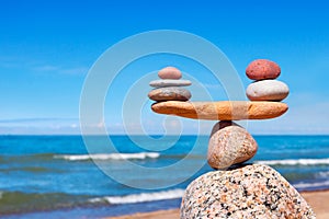 Concept of harmony and balance. Balance stones against the sea. photo