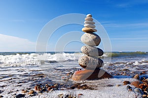 Concept of harmony and balance. Rock Zen near the sea