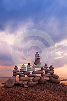 Concept of harmony and balance. Rock Zen at sunset. Balance and poise stones against the sea