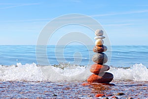 Concept of harmony and tranquility. Rock Zen near the sea