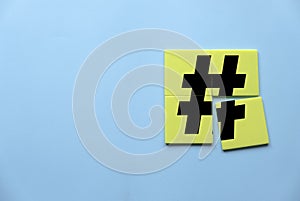 Concept of hashtag, viral post through web network,social media or blog. Tag for marketing and trend. Icon of hashtag on a yellow