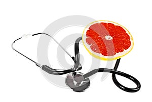 Concept for healthcare - slice of grapefruit and stethoscope on white background