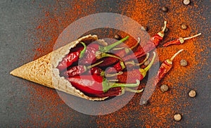 The concept of a healthy diet in the form of ice cream with pepper. On a black background, top view