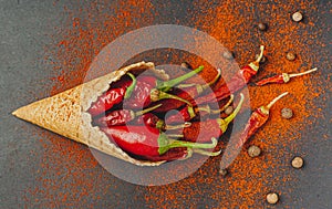 The concept of a healthy diet in the form of ice cream with pepper. On a black background, top view