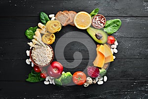 Concept of healthy food: bread, pasta, avocado, flour, pumpkin, broccoli, beans, spinach. Vegetables and fruits.