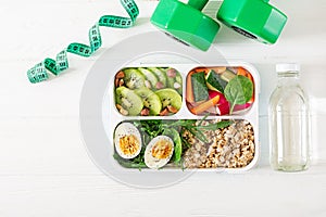 Concept healthy food and sports lifestyle. Vegetarian lunch. Healthy breakfast. Proper nutrition. Lunchbox. Top view. Flat lay photo