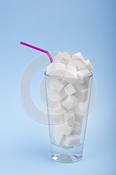 Concept of hidden sugar in soda, a source of energy and fast carbs. Vertical arragement