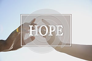 Concept of hope. Man and woman reaching hands to each other, closeup