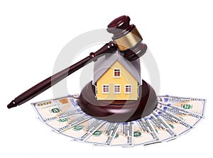 Concept of house sale with gavel and money isolated