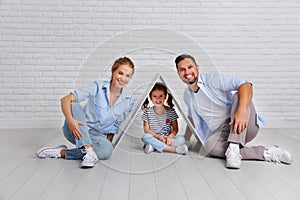 Concept housing young family. Mother father and child in new h