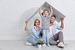 Concept housing young family. Mother father and child in new h