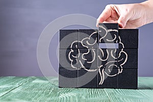 The concept of the human brain. Education, science and medical concept.  Brain drawn in chalk on black cubes
