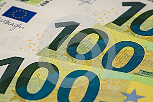 Concept Idea: A fragment of 100 euro banknote in macro as a background for finance theme