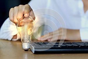 Concept ideas and light bulbs with connecting wires. Business people show new ideas by using innovative technology and creativity