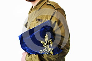 Concept: IDF, Religion in army of Israel. Religious soldier with Jewish prayer set on a white background photo