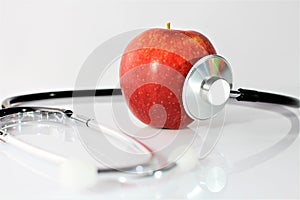 An concept image of a apple and a stethoscope