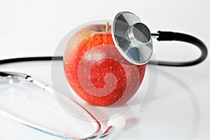 An concept image of a apple and a stethoscope