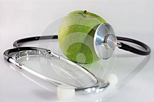 An concept image of a apple and a stethoscope