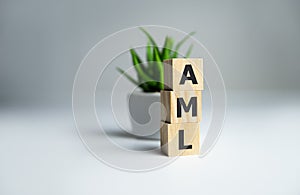 Concept image of Business Acronym AML Anti Money Laundering written on wooden cubes