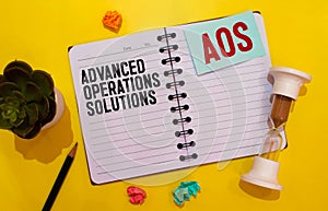 text Advanced Operations Solutions - AOS on white paper photo