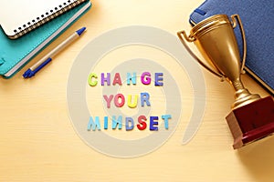 concept image with change your mindset text. top view of office table