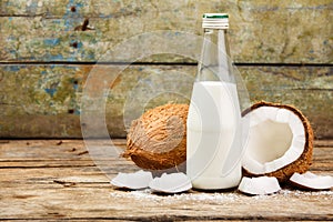 Concept image of cocnuts with bottle of milk