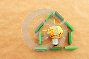 Concept image of green crumpled paper lightbulb, symbol of scr, innovation and eco friendly business