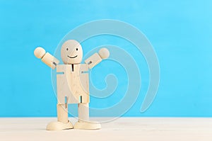 Concept image of happy mind and positive thinking. Wooden figure with smiling face