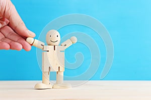 Concept image of happy mind and positive thinking. Wooden figure with smiling face