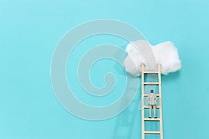 Concept image of ladder reaching the clouds, goal achieving and leadership idea