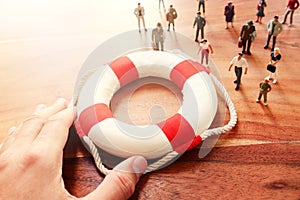 Concept image of life buoy protecting group of people. Rescue and support in times of crisis metaphor