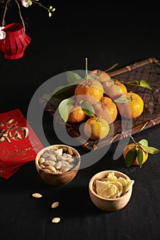 Concept image of the lunar new year - mandarin orange, jam and red packet