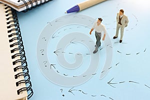 Concept image of people thinking about solving a problem and looking for a right way