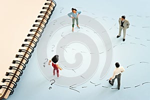 Concept image of people thinking about solving a problem and looking for a right way