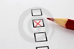 An concept Image of a red pencil and a questionnaire