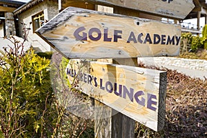Concept image of a signpost with golf course information