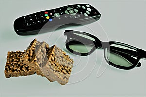 An concept Image of watching televison with 3D glasses and Popcorn, Snack