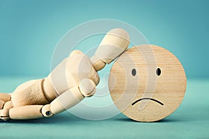 Concept image of wooden dummy with worried stressed thoughts. depression, obsessive compulsive, adhd, anxiety disorders concept