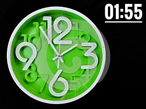 Concept image with word 01:55.Clock on black background. Time is 01:55 am or pm. One o'clock pass fifty five minute am or pm.