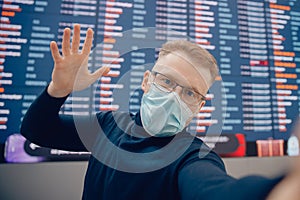 Concept immigration from country. Selfie photo caucasian young man in protective mask background information board in