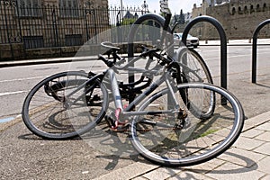 Concept of incivility with bicycles fallen to the ground in a street in Vannes